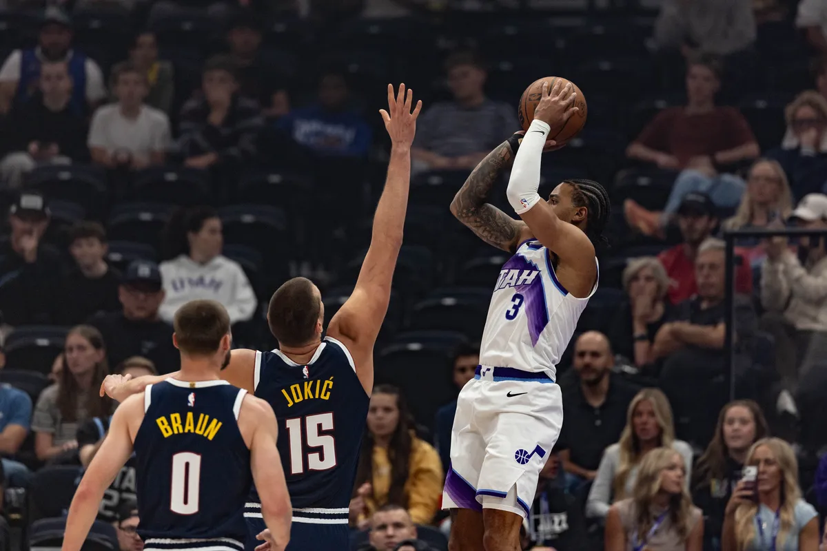Keyonte George shooting over Nikola Jokić